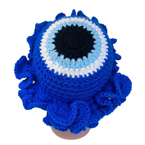 Royal Blue Evil Eye Handmade Crochet Ruffle Halo Brim Bucket Hat Condition: New; Ready To Ship Color: Royal Blue, Black And White Unstretched Flat Approximate Measurements: Approximately 6” Width (Across Top); 3.5” Length (Body); 2” Length (Brim) Head Size For Ideal Fit 19-20” S (*Model Head Is 19.5”*) Materials: 100% Acrylic Machine Washable; Lay Flat To Dry *Custom Orders For Larger Size Available* Crochet Loom, Fluffy Bucket Hat, Evil Eye Symbol, Purple Weave, Rabbit Fur Hat, Crochet Ruffle, Eye Symbol, Floral Hat, Pink Lemon