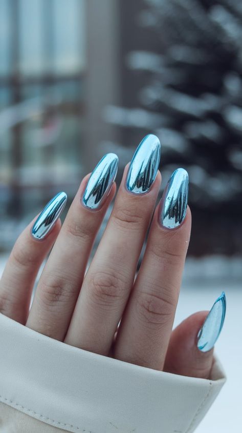 Cool down with icy blue chrome nails this winter! These bold, shimmering nails are inspired by frosty mornings and snowy landscapes. Perfect for the fashion-forward, they’ll add a pop of color and shine to your seasonal style. #IcyBlueNails #WinterChrome #FrostyVibes #BlueNailArt #WinterTrend Chrome Dot Nails, Iced Blue Nails, Winter Icy Nails, Ice Chrome Nails, Sns Nails Designs Winter, Winter Nails Ideas Blue, Aqua Blue Chrome Nails, Blue And White Chrome Nails, January Chrome Nails