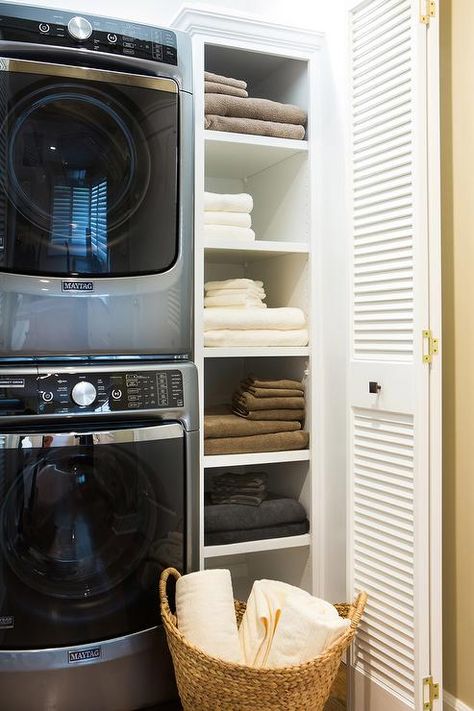 Vertically stacked, a washer and dryer along with a linen shelf, make up a simple, compact laundry room. Laundry Room Stackable, Compact Laundry Room, Stackable Laundry, Transitional Laundry Room, Closet Room Organizer, Stacked Laundry Room, Laundry Room Storage Shelves, Compact Laundry, Small Laundry Room Organization