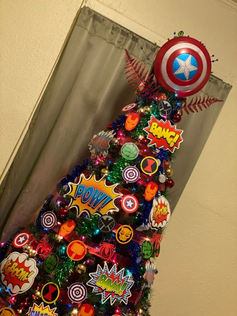 Superhero Themed Christmas Tree, Avengers Christmas Tree Ideas, Justice League Christmas Tree, Marvel Christmas Tree Ideas, Gamer Christmas Tree, Super Hero Christmas Tree, Spiderman Christmas Tree, Superhero Christmas Tree, Avengers Christmas Tree