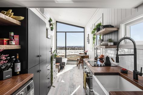 This tiny cabin’s asymmetrical roofline uses a Scandinavian-inspired interior to keep warm during winter Tiny House Luxury, Plywood Interior, Standing Seam Metal Roof, Cama King Size, Tiny Cabins, Tiny Cabin, Tiny Houses For Sale, Butcher Block Countertops, Container Homes