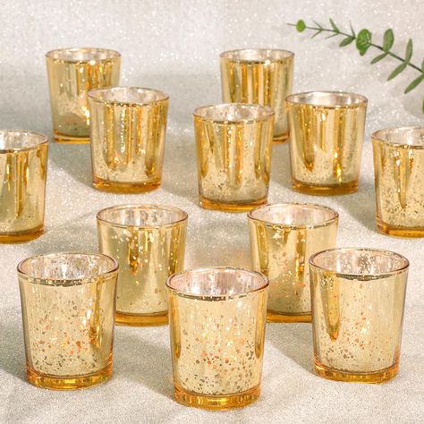 PRICES MAY VARY. Gold Votive Candle Holders Set: These glass candle holders are made with shiny exterior and translucent speckled interior, showing a dazzling light. When you light the candle, charming speckled glass can reflect the candle's light and adds to their brilliance, perfectly creating a warm and romantic ambiance for any occasions. Glass-Made Votive Candle Holders Bulk: These tealight candle holders are crafted from thick and high temperature resistant glass, designed to withstand pro Candle Centerpieces 50th Anniversary, Winter Bridal Shower Tables, Center Pieces With Candles And Fairy Lights Wedding, Table Settings 60th Birthday, Table Twinkle Lights, Wedding Centerpieces Elegant Candle Holders, Gold Centerpiece Table, Gold Star Table Centerpiece, Floating Candle Centerpieces With Gold