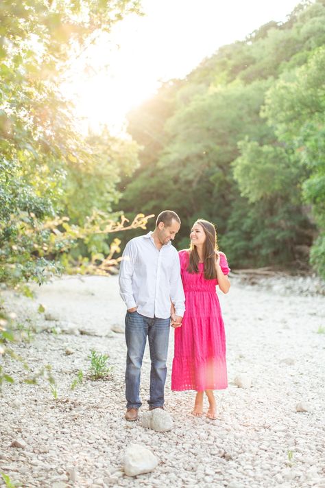 Magenta Anthropologie midi dress, white creek bed, rose gold engagement ring, and lush summer colors! The most beautiful Austin Greenbelt engagement session! What an honor to be their Austin wedding photographer! #austinengagementphotographer #ausinbride #greenbelt #austinengagementsession Pink And Blue Engagement Photos, Pink Engagement Photos, Engagement Photos Colorful, Pink Dress Engagement Photos, Pink Engagement, Engagement Picture Outfits, Bright Pink Dresses, Couple Outfit Ideas, Engagement Season