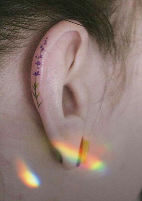 Mini Ear Tattoos, Ear Tattoo Colorful, Dainty Ear Tattoos For Women, Lavender Ear Tattoo, Pride Ear Tattoo, Color Ear Tattoo, Ear Tattoo Aesthetic, White Ear Tattoo, Colorful Ear Tattoo