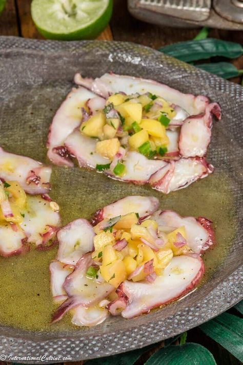 This octopus appetizer will transport your taste buds right to the Caribbean Islands.  A lovely dish you will make again and again. #octopusrecipe #caribbeanfood #octopuscarpaccio #appetizer #internationalcuisine #worldfood Octopus Carpaccio Recipe, Octopus Appetizer, Caribbean Octopus, Octopus Ceviche, Octopus Carpaccio, Octopus Salad, Octopus Recipes, Salsa Ingredients, Mango Salsa