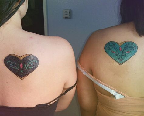 Disney Frozen Sister Tattoos. Anna and Elsa. Sister Corrination Day Dresses. Frozen Elsa Tattoo, Elsa And Anna Tattoo, Frozen Heart Tattoo, Disney Frozen Tattoo Ideas, Frozen Tattoo Disney Sisters, Anna Tattoo, Tattoo Sisters, Elsa Sister, Frozen Tattoo