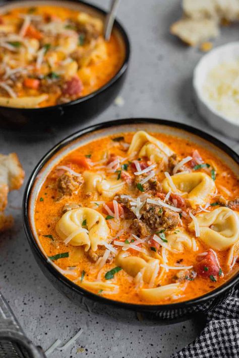 Loaded with Italian sausage and tender cheese tortellini this soup is easy, comforting, and full of creamy, cheesy goodness! Sausage And Tortellini Soup, Sausage And Tortellini, Sausage Tortellini Soup, Sausage Soup Recipes, Sausage Tortellini, Italian Sausage Recipes, Tortellini Recipes, Ground Italian Sausage, Hot Sausage