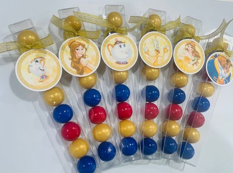 "PLEASE be sure to order your favors at least 2 weeks prior to the event to insure timely delivery.  This listing is for 6 filled and tagged tubes.  These gumball favors are filled with dark blue , red and gold colored gumballs.  Each tube includes a character from \"Beauty and the Beast\" tag and gold glittered ribbon for a splash of color. These would be perfect for your Beauty and Beast themed birthday party!  If you are interested in any other theme or quantity please convo me.   *DISCLAIMER Beauty And The Beast Sweet 16 Theme, Beauty And The Beast Favors, Beauty And The Beast Party Favors, Beauty And The Beast Gender Reveal, Diy Beauty And The Beast Party, Beauty And The Beast Party Ideas, Beauty And The Beast Birthday Party, Beauty And The Beast Quinceanera, 28th Birthday Ideas