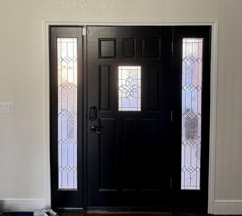 A front door is painted with SW Tricorn Black, surrounded by SW Pearly White walls. Sw Pearly White, Tricorn Black Front Door, Sw Tricorn Black, Tricorn Black, Black Front Door, Black Front Doors, Screen Door, Paint Ideas, Sherwin Williams