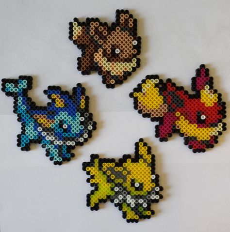 Perler Bead Sprites of the Kanto Eeveeloutions!    See More here! https://www.etsy.com/listing/218753857/pokemon-eevee-vaporeon-jolteon-flareon?ref=shop_home_active_1 Pokemon Perler Bead Patterns Eevee, Vaporeon Perler Beads, Eevee Perler Beads, Eevee Pixel Art, Eevee Perler, Eevee Vaporeon, Melty Bead Designs, 3d Pokemon, Pokemon Perler