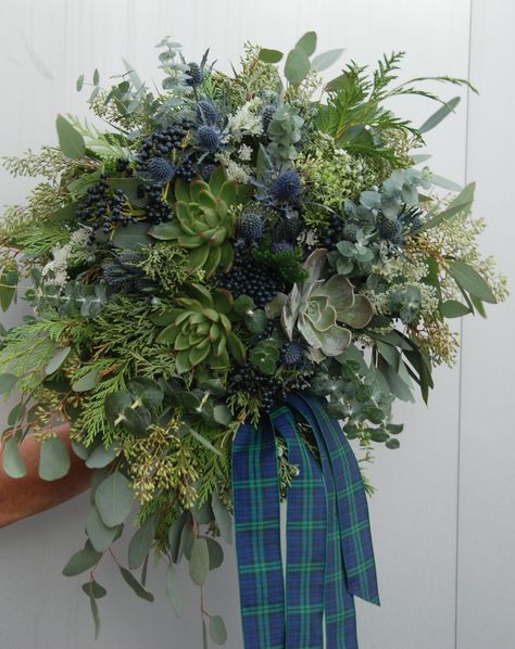 Wedding flowers: Bride's bouquet, succulents, blue thistle Queen Anne's lace,  eucalyptus, viburnum berries, cedar with Scottish plaid ribbon Scottish Flower Bouquet, Scottish Summer Wedding, Thistle Centre Pieces Wedding, Scottish Flower Arrangements, Winter Flowers Bouquet, Scottish Wedding Bouquet, Scottish Centerpieces, Scottish Wedding Decorations, Scottish Wedding Flowers