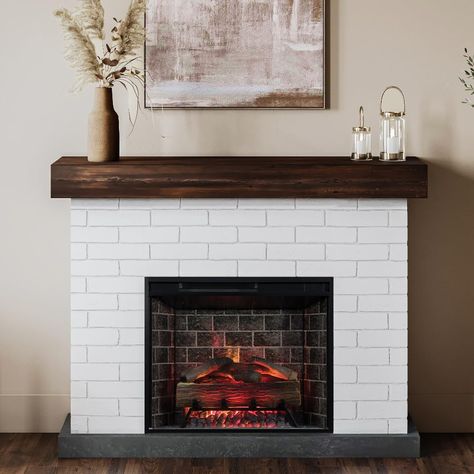 PRICES MAY VARY. INCLUDES ELECTRIC LOG SET FIREBOX: The smart 28 inch electric fire box fits perfectly into the mantel surround and also pairs with the Tuya Smart App or with the Google Assistant/Amazon Alexa. FAUX BRICK: The charming white finish on the faux brick creates a timeless aesthetic and farmhouse style to your living space. REALISTIC LOGS AND EMBER BED: The realistic resin logs and glowing ember ashbed offer a cozy, life-like experience. Feel free to set a timer for 1-9 hours of conti Jackson White, Wood Mantel Shelf, Electric Fireplace With Mantel, Mantel Surround, Wood Mantel, Gas Fireplace Insert, Fireplace Heater, Wall Mount Electric Fireplace, Electric Fireplace Insert