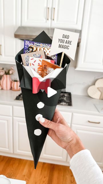 Mimi Markopoulos on Instagram: "🖤Father’s Day DIY - Paper Tuxedo Cone🤍 .  Stumbled upon this adorable DIY project by the talented creator @bellarteskids on TT and instantly felt inspired to give it a go, especially since I had all the necessary materials on hand! This simple yet charming DIY idea is ideal for crafting the perfect Father’s Day gift vessel.  The lovely Father’s Day print I used is from @oliveandeveco! Their collection of printables for various holidays is simply amazing, and at just $5, O&E offers fantastic options to elevate your gifts and decor. 😍 . More Father’s Day DIY ideas coming up 🤍🤍 . . . . . . #fathersday #fathersdaydiy #fathersdaygift #craftymom #girl@im #mdblogger #mdgirlmom #makeitwithmichaels #cardstockcrafts #cardstock" Fathersday Gift Diy, Fathers Day Gifts Ideas From Kids Diy, Fathers Day Activities For Kids, Fathers Day Decoration Ideas, Fathersday Gift Ideas, Diy Father's Day Decorations, Fathers Day Activities, Balloon Bar, Cones Diy