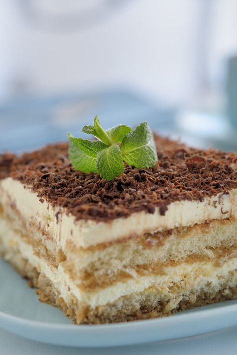 Mock Tiramisu - Traditional tiramisu is made with ladyfingers and mascarpone. This mock version uses sliced pound cake and Neufchatel cheese to simplify things. Made with instant coffee granules, water, pound cake, Neufchatel cheese, whipped topping, rum extract, sugar, baking cocoa or grated chocolate | CDKitchen.com Best Tiramisu Recipe, Easy Tiramisu Recipe, Neufchatel Cheese, Tiramisu Dessert, Tiramisu Cake, Tiramisu Recipe, Chocolate Cheese, A Piece Of Cake, Crochet Food