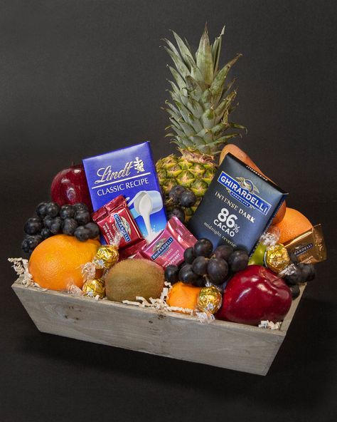 Fruit and chocolate make the perfect combo! Treat that special someone to an array of decadent Ghirardelli and Lindt chocolates, paired with the season's freshest fruit in a keepsake wooden crate.  Don't forget to add on your favorite bottle of wine during checkout to make this gift extra special!    FRUIT, FRUITS, CHOCOLATE, CHOCOLATES, CHOCOLATE BASKET, BASKET, BASKETS, GOURMET, GOURMET, SNACK, SNACKS Chocolate Basket Ideas, Fruit Basket Delivery, Fruit Gift Baskets, Fruit And Chocolate, Engagement Gift Baskets, Fruit Hampers, Wine Country Gift Baskets, Chocolate Basket, Fruit Chocolate