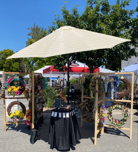 A backyard umbrella works nicely for small display spaces. A white or light colored umbrella is best, so it doesn’t cast other colors on your goods. Backyard Umbrella, Umbrella Wreath, Craft Fair Booth Display, Craft Show Booth, Fair Booth, Craft Fairs Booth, Crochet Table, Craft Show Displays, Show Booth