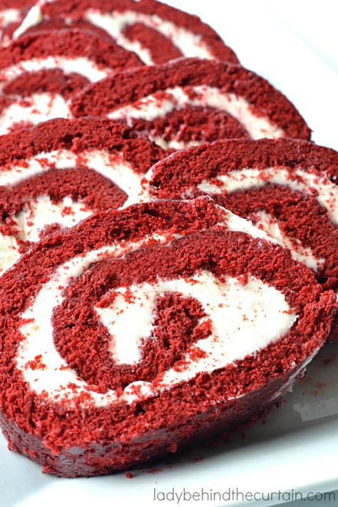 Red Velvet Cake Roll. A beautiful bright red sponge cake, with a hint of chocolate, light, fluffy, and a cream cheese filling—the perfect holiday dessert.