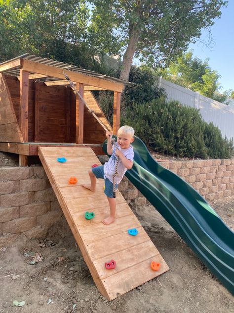 Retaining Wall Play Area, Retaining Wall Playground Ideas, Retaining Wall Playground, Slide On Hill Backyard, Backyard Hill Playground, Sloped Yard Playground, Playground Built Into Hill, Hill Playground Ideas, No Grass Play Area