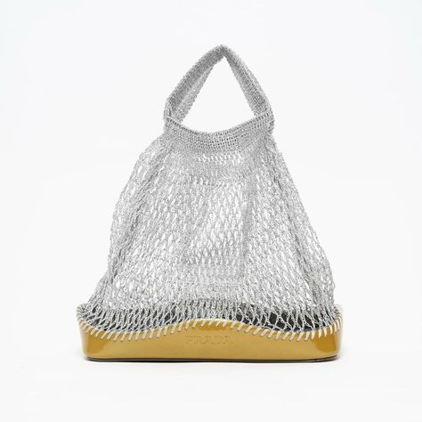 The cutest @prada FW 1999 metallic silver fishnet mini-bag 🖇️ This rare archive piece features a bucket bag silhouette and is made of metallic gold brushed leather contrasting the finely woven metallic silver fishnet. With hot-stamped ‘PRADA’ logo in the front and bag interior. Made in Italy. Comes with its authenticity card. 9/10 condition Measurements Width 18cm Height 24cm Depth 9cm Handle drop 10cm Dm to buy or visit our Berlin store in Neukölln. We’re open Wednesday-Saturday 12-6pm... We Re Open, Bag Silhouette, Bag Interior, Prada Logo, Metallic Gold, The Cutest, Mini Bag, Bucket Bag, Metallic Silver