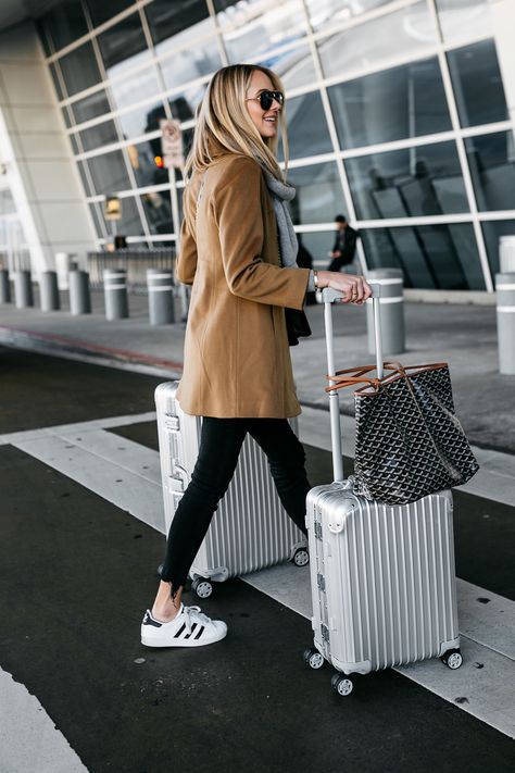 Blonde Woman Wearing Camel Coat Black Ripped Skinny Jeans adidas Superstar Sneakers Rimowa Luggage Fashion Jackson Dallas Blogger Fashion Blogger Street Style Airport Style Adidas Superstar Outfit, Rimowa Luggage, Superstar Outfit, Comfy Airport Outfit, Travel Attire, Fashion Travel Outfit, How To Wear Sneakers, Airport Outfits, Look Adidas