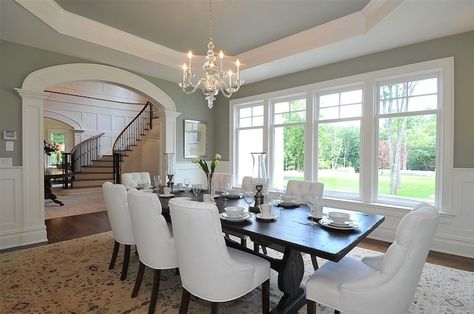 Traditional dining room with sage green paint color, octagon tray ceiling, arched doorway, salvaged wood dining table, white tufted dining chairs, wainscoting and Visual Comfort Lighting Small Faceted George II Chandelier. Dining Room Tray Ceiling, Tray Ceiling Paint Ideas, Tray Ceiling Ideas, Ceiling Dining Room, Dining Room Paint Colors, Green Dining Room, Transitional Dining Room, Traditional Dining Rooms, Dining Room Paint