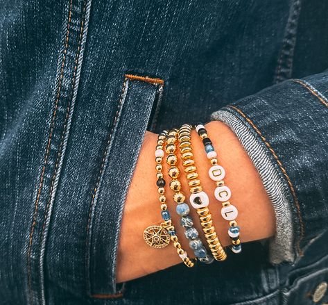 This stack is made primarily with gold plated beads and is mixed throughout with glass seed beads. One bracelet features Denim Blue Impression Jasper gemstones, which resemble the ocean and Earth. The stack is completed with an elegant pave gold compass charm. The "DCL" bracelet can be customized with any name or other wording if something different than what is pictured is preferred. Bracelet Stack Gold, Travel Bracelet, Vacation Jewelry, Disney Bracelet, Gold Beaded Bracelet, Custom Bracelet, Gold Bead Bracelets, Cruise Line, Disney Cruise Line