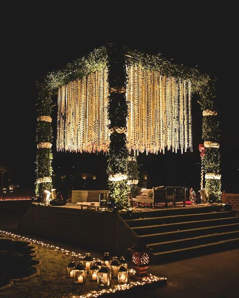 This gardenia mandap is oomphing out major decor goals . . Decor @auraaffaire Originally Featured on @weddecor.in . . . Follow us for more decor inspiration for your dream wedding.First premium page for all your decor fantasies. Tag us @weddecor.in to get featured. Email your original work at weddecorindia@gmail.com #weddecor #mandapdecor #intimatemehndi #intimateweddings #haldidecor #mehndidecor #fun #calmingdecor #beautifuldecor #weddinginspiration #weddingdecor #indianweddings #weddin Wedding Mandap Decoration Night, Luxury Wedding Decor Indian, South Indian Night Wedding, Mandap Decor Night, Indian Wedding Decor Aesthetic, Marriage Mandap Decoration Indian Night, Mandap Design Night, Mandap Designs Outdoor Night, Mandap Decor Indian Outdoor Night