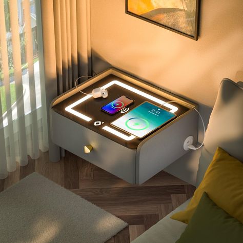 PRICES MAY VARY. Wall Mounted Nightstand:Our latest smart furniture bedside table is equipped with an 18W wireless charging station that supports built-in wireless charging for cell phones.It also has USB*4,Type-C*2 to meet all your device charging needs,eliminating the hassle of messy charging cables. Floating Nightstand:Add a touch of sophistication to your bedroom with our simple and understated hanging nightstand.The favorite style of young people,the hanging shape breaks away from the stere Bedroom Sound System, Low Profile Nightstand, High Tech Furniture, Big Nightstand Ideas, Water Nightstand, Home Tech Gadgets, Floating Night Stand Ideas, Things To Get For Your Room, Floating Nightstand Bedroom