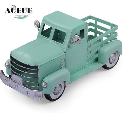 DIMENSIONS: Truck is 12" x 5.75" x 6.25"H and truck bed is 4.625" x 3.5" x 2.5"H. The truck wheels do not roll. This is a decorative piece, not a toy for kids. | AQUABUBINC Easter Truck Sculpture Metal in Green, Size 6.0 H x 12.0 W x 6.0 D in | Wayfair | Home Decor Truck Planter, Farmhouse Truck, Truck Decor, White Truck, Antique Turquoise, Spring Decorations, Rabbit Decor, Dining Table Centerpiece, Farm Trucks