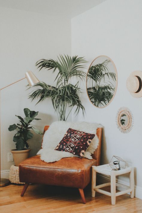 3 Ways to Style an Awkward Corner of Your Apartment | Advice from a Twenty Something Home Decor Ideas | Styling a Leather Chair and Greenery in a Corner Space Plant Behind Chair In Corner, Plant And Lamp In Corner, Boho Corner Chair, Behind Chair Decor, Tall Corner Decor, Rustic Reading Nook, Moving Into A New Apartment, Awkward Corner, Brown Leather Chairs