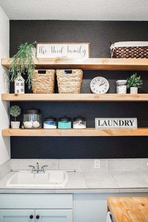 Wood Shelf In Laundry Room, Black Floating Shelves Laundry Room, Shelf Decor Laundry Room, Wood Laundry Room Shelves, Butcher Block Shelves In Laundry Room, Laundry Shelves Decor, Modern Coastal Laundry Room Ideas, Black With Natural Wood, Laundry Room With Floating Shelf