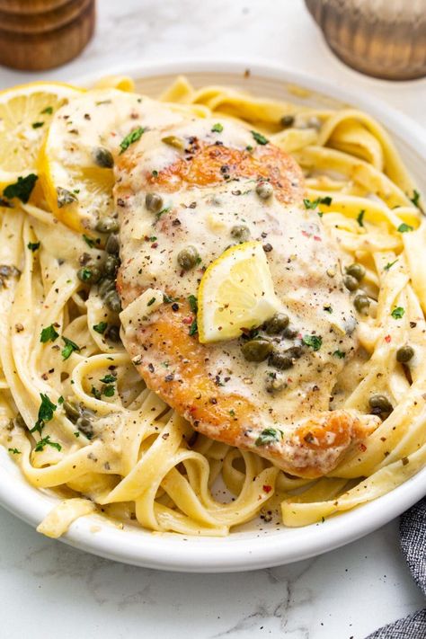 Creamy lemon chicken piccata is a delicious 30-minute meal with lightly breaded chicken breasts smothered in a garlic and caper cream sauce. Creamy Lemon Chicken Piccata, Caper Cream Sauce, Lightly Breaded Chicken, Lemon Chicken Piccata, Piccata Recipe, Creamy Lemon Chicken, Breaded Chicken Breast, Chicken Piccata, Breaded Chicken