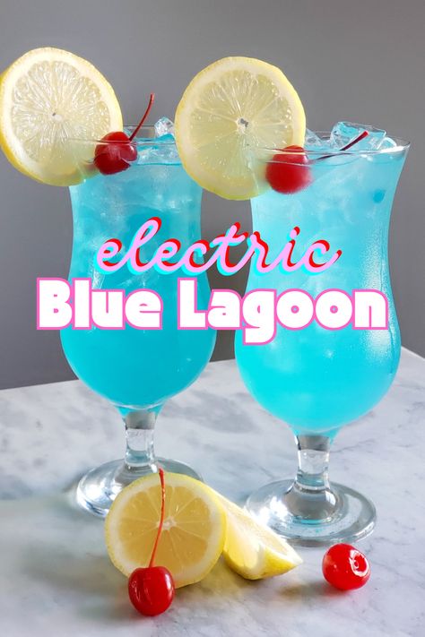 The Blue Lagoon cocktail is as visually striking as it is tasty. A mix of vodka, blue curaçao, fresh lemon juice, and simple syrup results in a citrusy drink with an electric blue hue. It’s the perfect drink to sip at tropical-themed gatherings or an 80s-themed party. 90s Cocktails Drink Recipes, 80s Alcoholic Drinks, Blue Vodka Cocktails, 80s Karaoke, Blue Lagoon Drink, Cocktails With Blue Curacao, Raspberry Lemonade Vodka, Quince Food, Blue Curacao Drinks