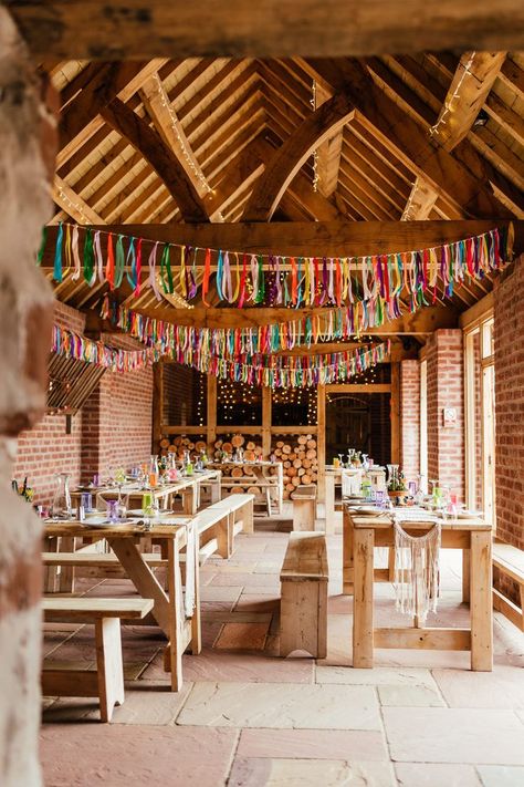 Colourful barn wedding reception with wooden tables and benches and colourful streamers. Grace Loves Lace Wedding Dress, Wedding Streamers, Wedding Dress Outdoor, Bucking Bronco, Colourful Wedding, Rainbow Wedding, Summer Wedding Colors, Rock My Wedding, Grace Loves Lace