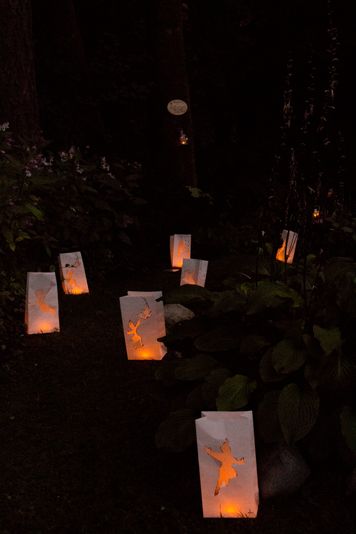 Peter Pan themed paper bag lanterns lining the forest path to the fairy section of our Peter Pan themed backyard wedding stylized photoshoot Peter Pan Homecoming, Neverland Wedding Theme, Fairytale Homecoming Theme, Tinkerbell Wedding, Neverland Wedding, Stylized Photoshoot, Enchanted Prom, Paper Bag Lanterns, Peter Pan Wedding