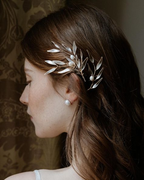 Introducing our Branch Hair Accessory, inspired by the timeless symbolism of peace and victory from Ancient Greece. Crafted with delicately shaped olive branches, this accessory elegantly adorns your hair, infusing your look with a touch of classical elegance and modern charm. Whether you’re aiming for a serene, ethereal style or channeling inner strength and triumph, this accessory is the perfect embodiment of grace and resilience. Let your hair tell a story of peace and triumph with our Br... Ethereal Style, Olive Branches, Tell A Story, Olive Branch, Ancient Greece, Inner Strength, Bridal Hair Accessories, Hair Accessory, Bridal Hair