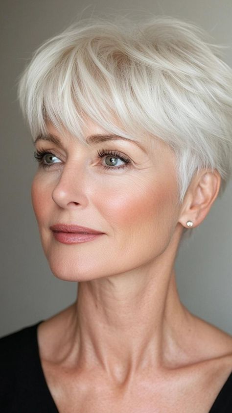 A pixie hairstyle is the ultimate option for women over 50 looking for a fresh, chic look. This short cut enhances your facial features and offers a stylish yet low-maintenance option. Whether you opt for a sleek, smooth finish or a more textured, edgy style, the pixie is always a hit. Grey Pixie Haircut Older Women, Shorter Haircuts, Fine Hair Cuts, Haircut Pixie, Too Cute To Handle, Short Pixie Bob, Flattering Hairstyles, Grey White Hair, Short Silver Hair