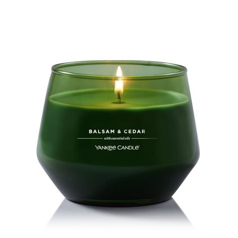 Balsam, aromatic cedar wood, and juniper berry blend together in a fresh forest scent. The Yankee Candle® Studio Collection is intentionally designed to fit seamlessly into your home. Each of these simply sophisticated, colored glass candles offers high-quality Yankee Candle fragrances made with essential oils. They can help create welcoming ambiance that makes everyday moments special for you and your loved ones. | Balsam and Cedar Studio Collection Yankee Candle, Dark Green, 3.9” x 3.2” | Wood Cedar Candle, Glass Candles, Candle Shades, Candle Studio, Earthy Scent, Juniper Berry, Green Candle, Essential Oil Scents, Cedar Wood