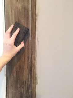 I wanted to give our two kitchen doors a makeover when we renovated our kitchen, and I really wanted them to look like old weathered wood. I couldn't afford new doors, so this paint technique was the next best thing! I have so many more tutorials over on my blog - I hope to see you there! Step 1 Be sure to tape off your door where you don’t want paint (i.e. the wall, the door frame, etc.) Also be sure to remove your door knobs. Step 2: Use your 3″ brush to paint on your ba… Door Frame Painting Ideas, Valspar Chalk Paint, Wood Painting Techniques, Cheap Diy Wall Art, Faux Wood Paint, Fake Wood, Perfect Pantry, Diy Nightstand, Faux Painting