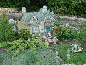 Fairy garden with Gnomenculture's Underfoot Cottage Fairy Garden Pictures, Gnome Doors, Wood Cottage, Gingerbread Cottage, Faerie Garden, Casa Hobbit, Whimsical Cottage, Hgtv Garden, Fairy Homes