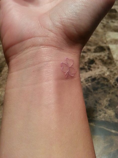 Three leaf clover.....My 1 day old small white ink shamrock wrist tat. I got it for my son. Lil mans b-day is St. Patricks Day. I got the 3 hearts/leafs cause there's only 3 of us in my lil family. Shamrock Wrist Tattoo, Small Shamrock Tattoo, Three Leaf Clover Tattoo, 3 Leaf Clover Tattoo, Jewlery Tattoo, Shamrock Tattoo, Leaf Clover Tattoo, Four Leaf Clover Tattoo, Clover Tattoo