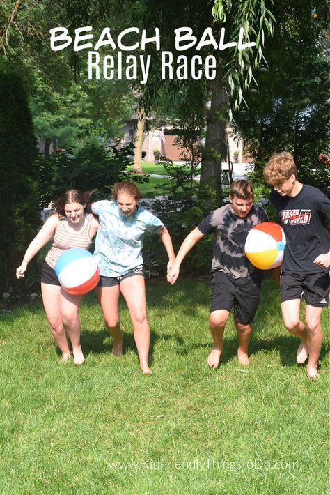 This Beach Ball Relay Race outdoor game is a blast to play. Perfect for large groups, youth groups, summer games, and backyard fun. www.kidfriendlythingstodo.com Camping Yard Games, Outdoor Games For Large Groups, School Relay Race Ideas, Bible Outdoor Games, Outdoor Family Games Relay Races, Relay Games For Family Reunions, Family Outdoor Games Backyards, Large Group Relay Games, Backyard Relay Games