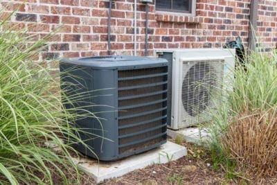 What To Plant Near AC Unit: How To Landscape Around An Air Conditioner Privacy Fence Around Air Conditioner, Plants Around Ac Unit, Ac Unit Landscaping Rocks, Rocks Around Ac Unit, Central Air Unit Cover Diy, Landscape Around Air Conditioner Unit, Landscaping Around Air Conditioner Unit, Landscaping Around Ac Unit, Hide Ac Unit Outside