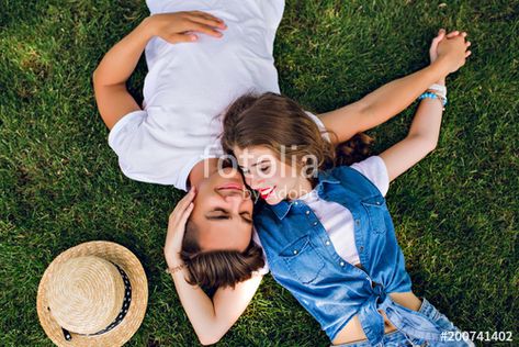 Download the royalty-free photo "Romantic couple of young people lying on grass in park. They lay on the shoulders of each other and hold hands together. They look happy. View from above." created by Look! at the lowest price on Fotolia.com. Browse our cheap image bank online to find the perfect stock photo for your marketing projects! Hand On Shoulder Reference Couple, Cute Paragraphs, Teenage Couples, People Lie, Pride Art, Hold Hands, Pose References, Make Love, Couples Poses