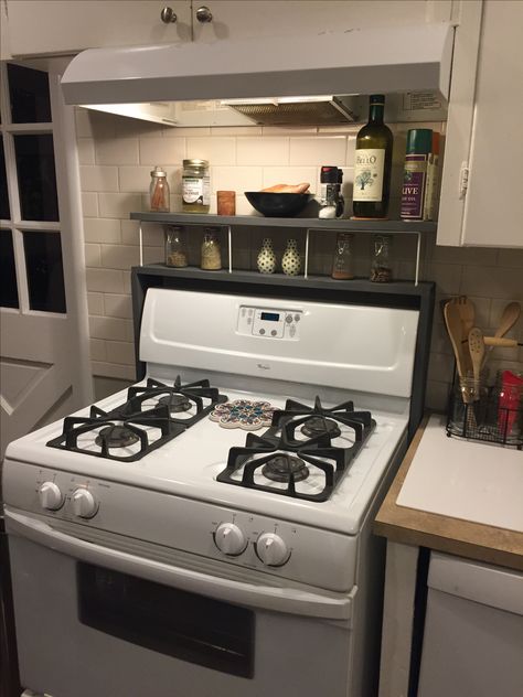 Built this storage option for over the stove. 1 x 4 lumber painted charcoal gray, using simple wire shelf risers in between. Very inexpensive build Behind The Stove Storage, Decor Above Stove, Oven Shelf, Kitchen Shelf Decor, Wire Shelf, Kitchen Shelf, Wire Shelving, New Home Designs, Shelf Decor