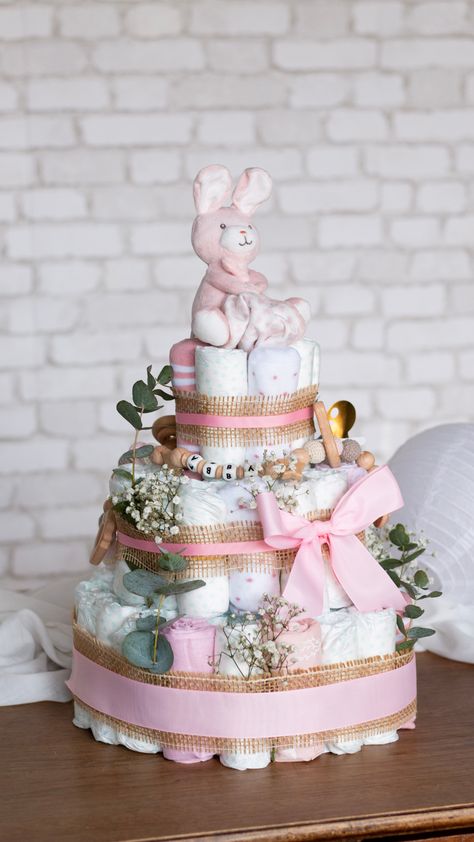 How To Diaper Cake, Easy Diaper Cake Ideas, Diaper Cake Baby Girl, Diaper Cake Ideas Girl, How To Make Diaper Cake, How To Make A Diaper Cake Step By Step, Baby Girl Diaper Cake Ideas, Baby In Bloom Diaper Cake, Boho Diaper Cake Girl