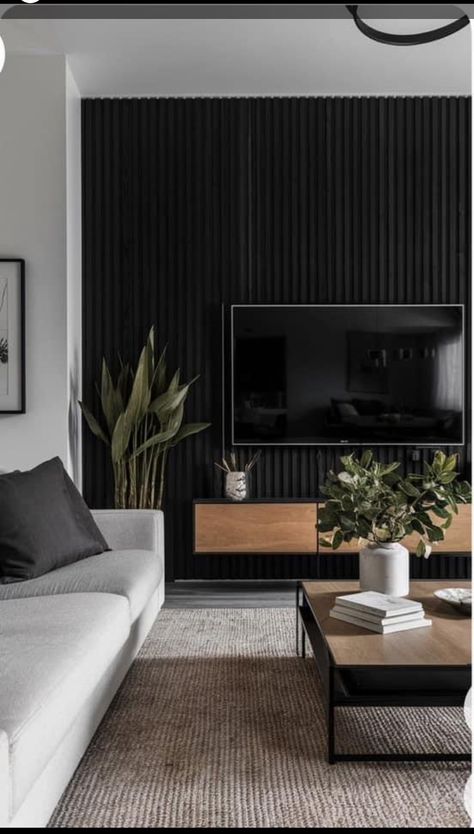 Tv Wall Styling Living Rooms, Wood Slat Wallpaper Living Room, Dark Feature Wall Living Room Tv, Tv On A Black Wall, Black Tv Fireplace Wall, Black Wood Slat Tv Wall, Black Wall Tv Living Room, Black Panel Tv Wall, Black Slat Tv Wall