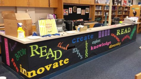 My updated circulation desk...really brightens the library.  Thanks Lynda and Karen Circulation Desk Decor, Public Library Decorating Ideas, Media Center Decor, Circulation Desk, School Library Decor, Library Space, School Library Design, School Library Displays, Middle School Libraries