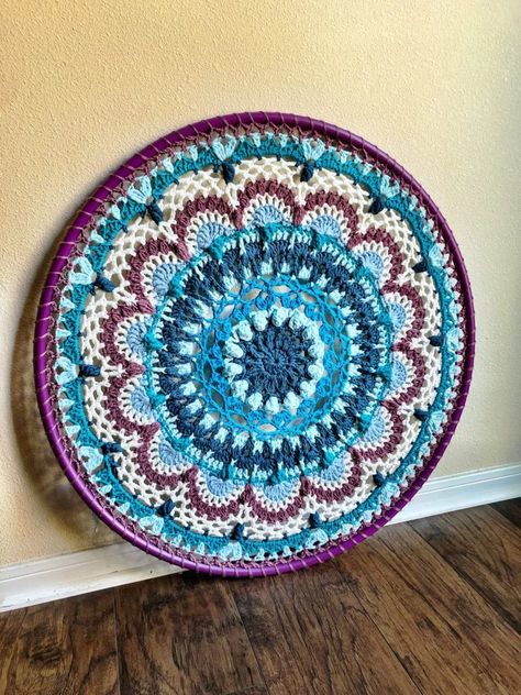 Namaste Mandala is a beautiful design that you can make for a 36in hula hoop with Scheepjes Chunky Monkey Yarn*. You can make this project with many colors as I have used, or even make it in a solid color for a different effect. Whatever you decide, I hope you enjoy making Namaste Mandala as… Continue reading Free Crochet Pattern: Namaste Hula Hoop Mandala (Aran Wt.) Mandala Crochet Free Pattern, Hoop Crochet, Crochet Name, Crochet Wall Decor, Crochet Rug Pattern, Name Wall Hanging, Turquoise Yarn, Mandala Yarn, Mandala Crochet