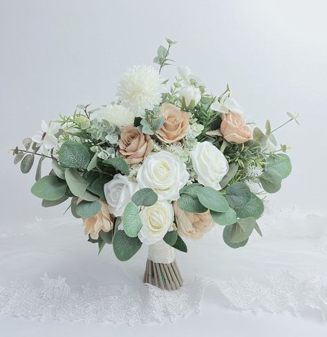 ❤️This bridal bouquet measures 13-15inches wide(1st picture), it is made with high quality, silk flowers ❤️Color :white,beige,green ❤️If you love this bouquet but would like it in a different color, or there is something you want added, removeed,please convo me with request and I will be happy to provide you with a quote. Please Note: all bouquet are handmade and made-to-order at the time of purchase，your bouquet will look like the listing photo ，no two items are ever identical ❤️production time Champagne Wedding Flowers, Wedding Bouquet White, Ivory Bouquet, Ivory Bouquet Wedding, Greenery Wedding Bouquet, Green Wedding Bouquet, Champagne Flowers, Green Wedding Flowers, Wedding Mint Green